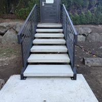 stringer staircase with iron railings built by Estate Iron Works in the Seattle area